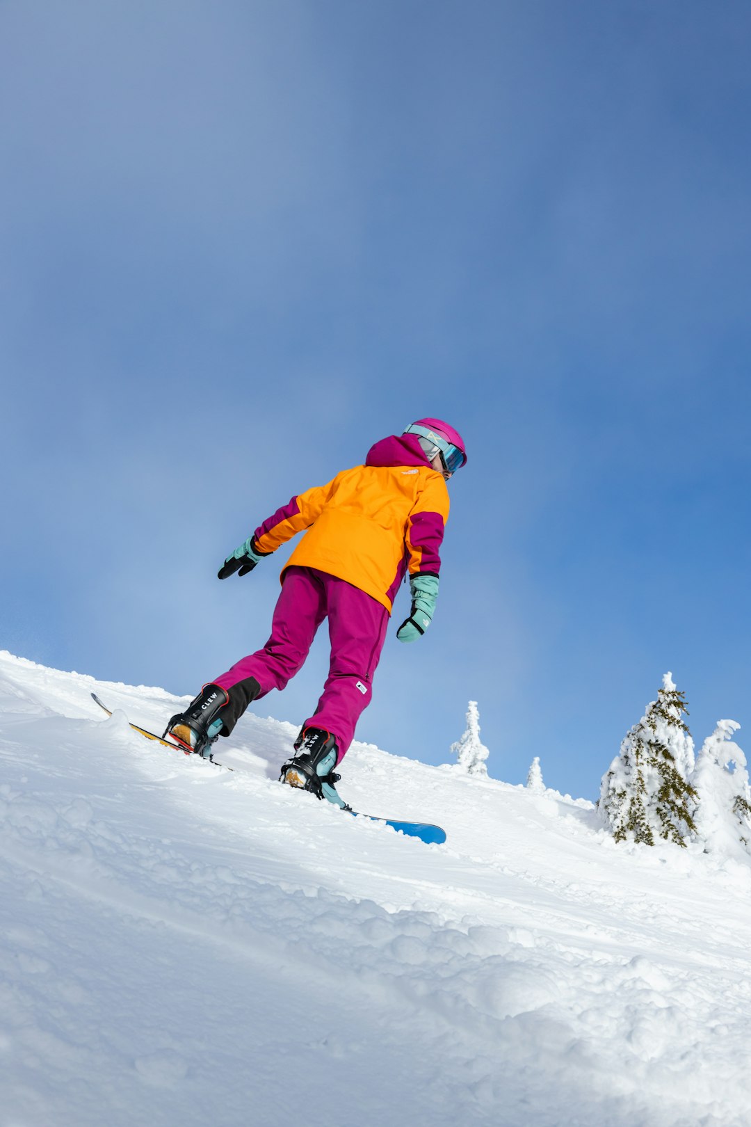 Home snowboarder in colorful clothing