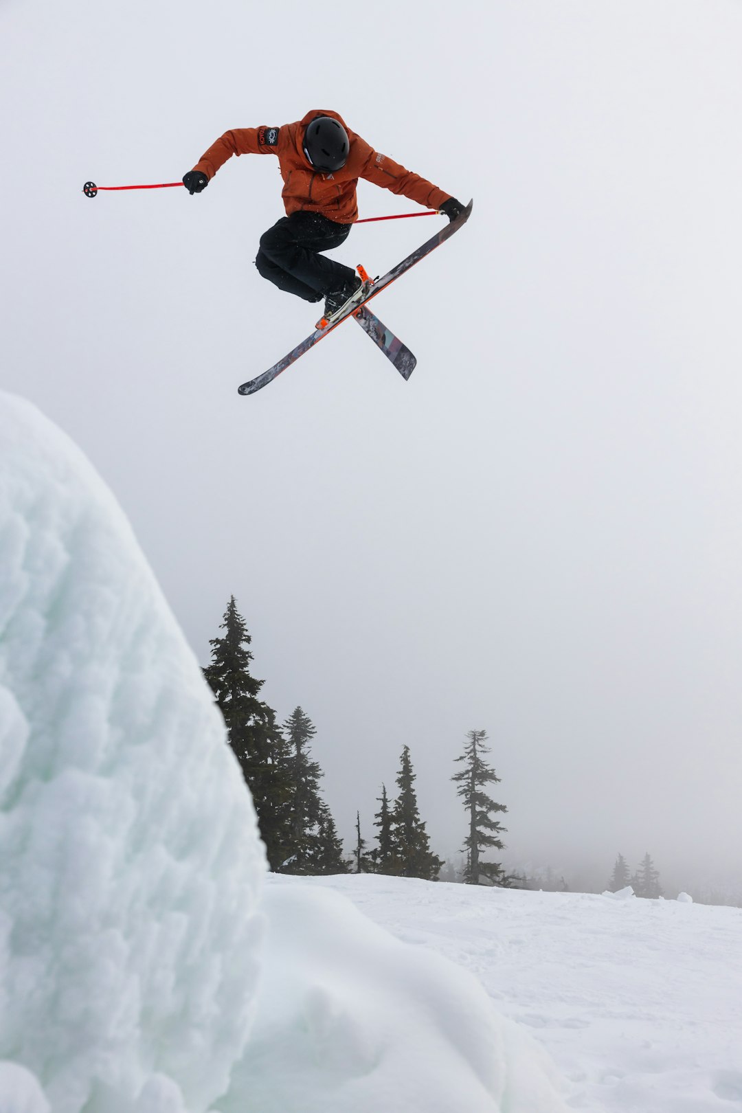 Home person freestyling ski jumping in the snow